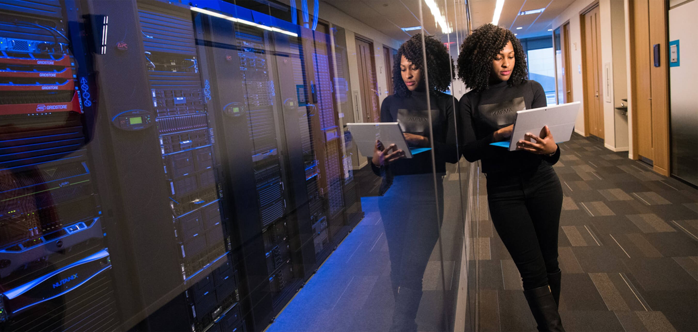 Woman standing in a datacentre